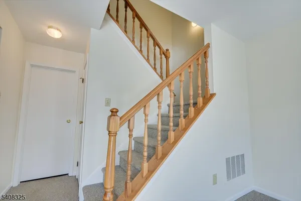 a bedroom with a large bed and a dresser
