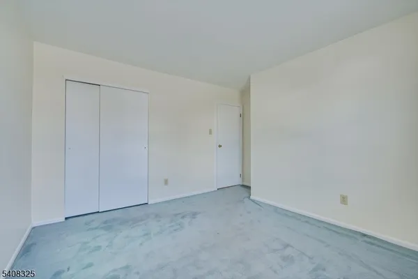 a bathroom with a sink a toilet a mirror and bathtub