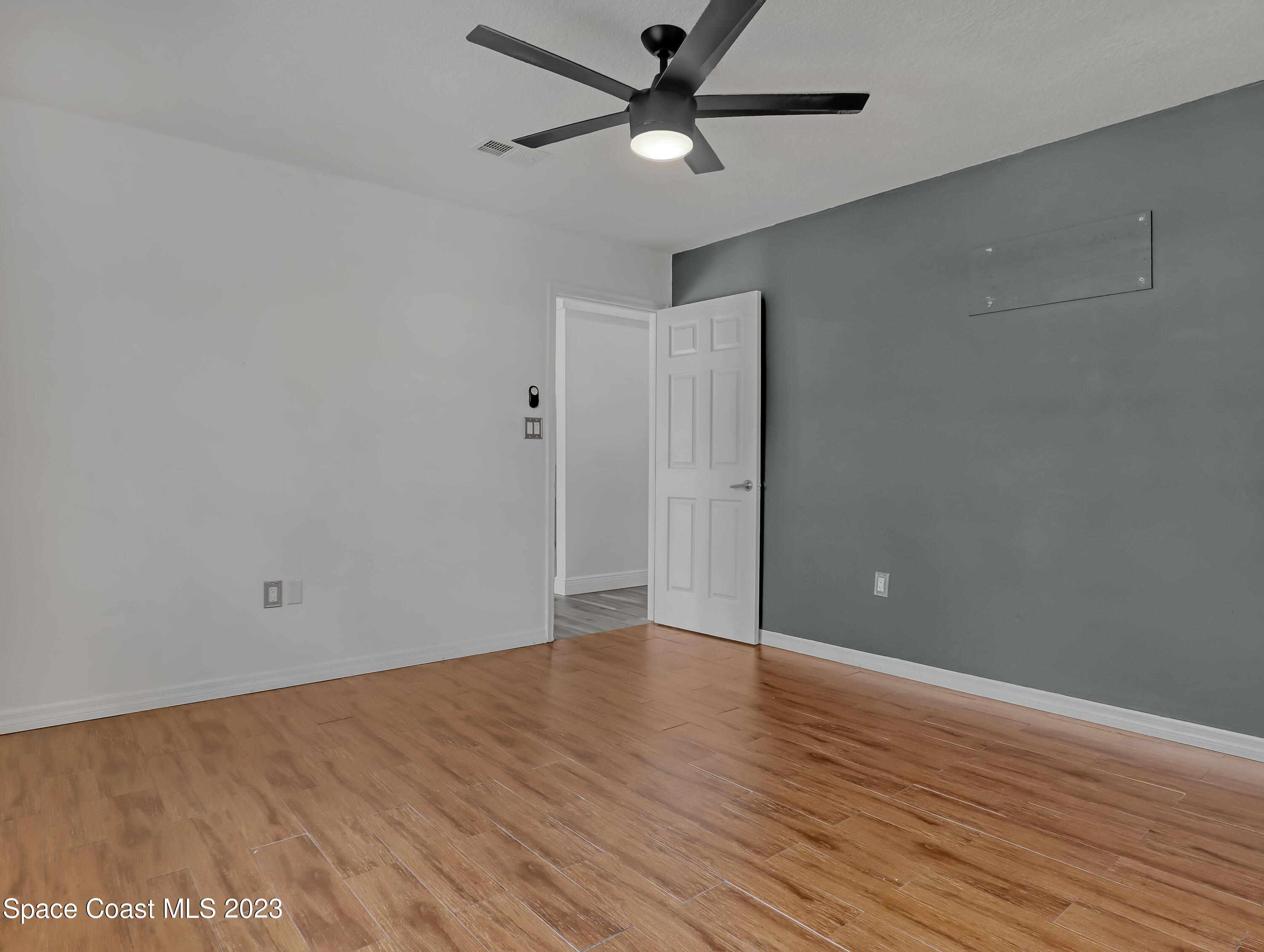 5233 Carrick Road Cocoa, FL 32927 - Photo 14 of 32 wooden floor in an empty room