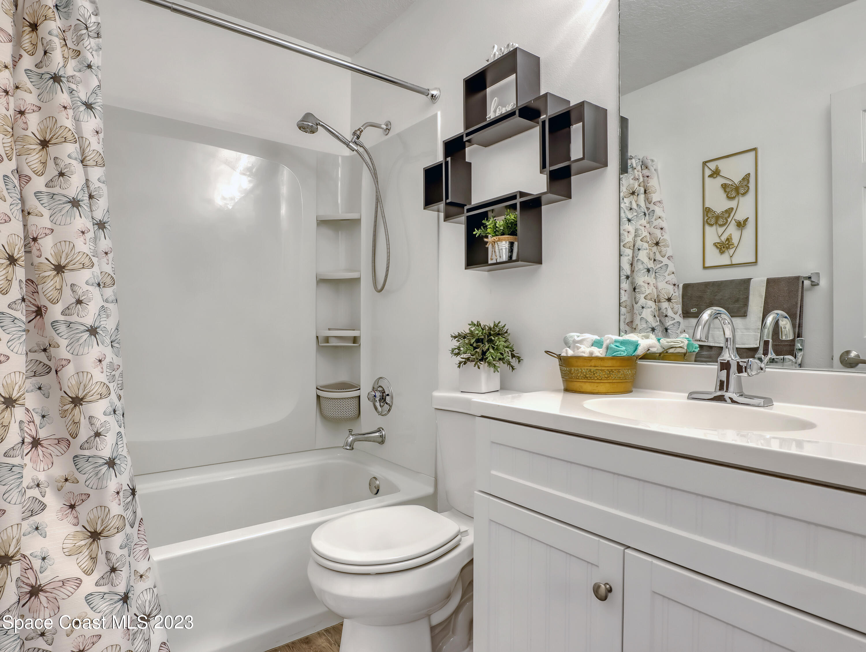 5233 Carrick Road Cocoa, FL 32927 - Photo 19 of 32 a bathroom with a sink toilet and shower