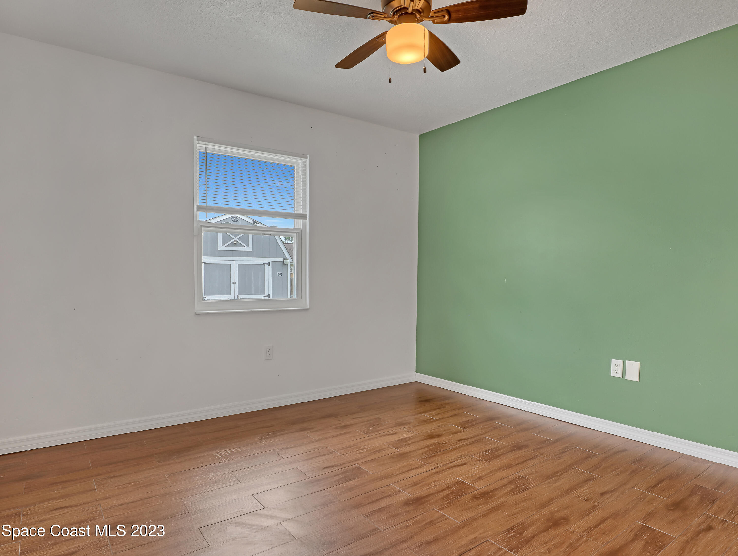 5233 Carrick Road Cocoa, FL 32927 - Photo 20 of 32 an empty room with a window