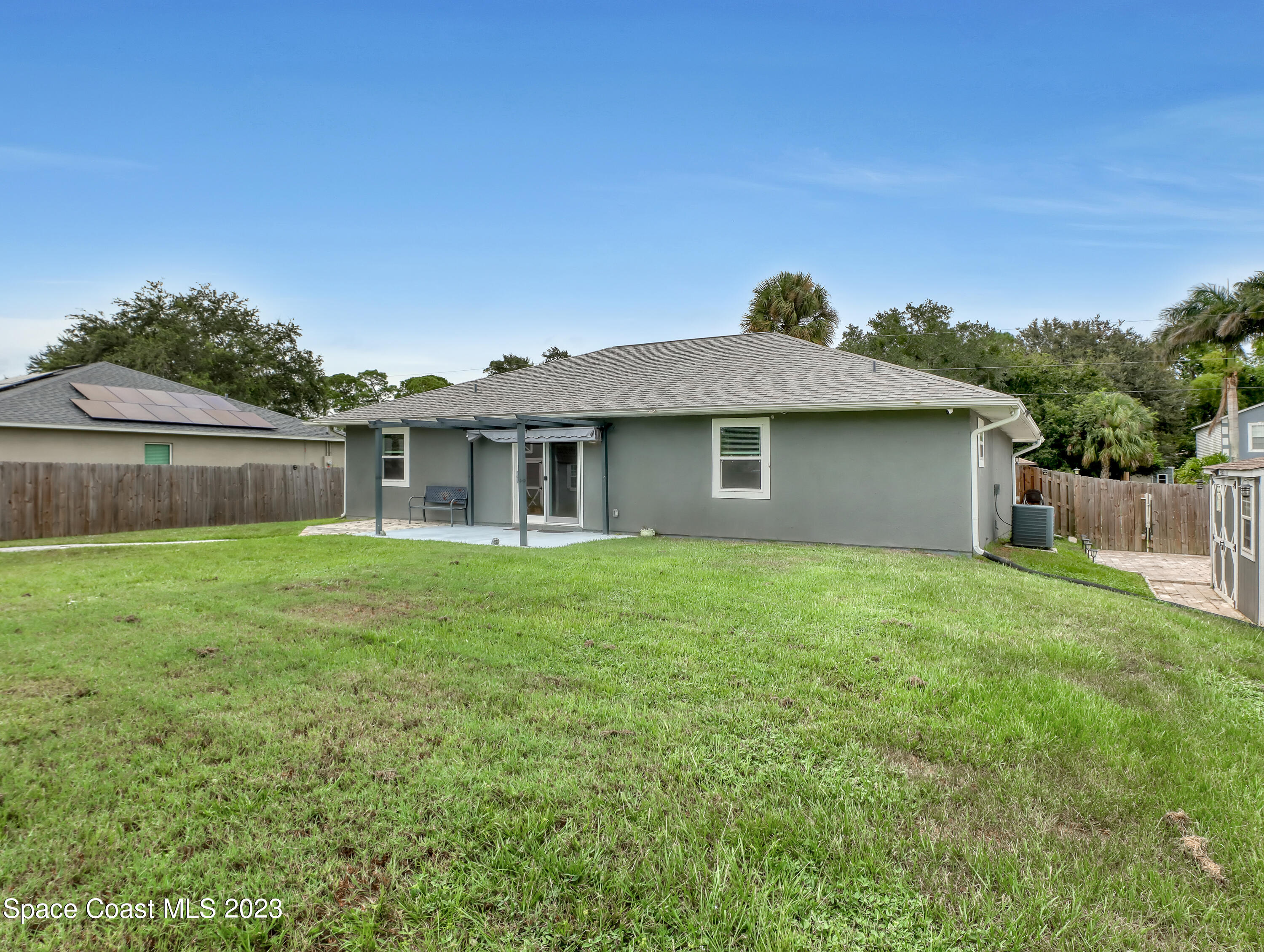 5233 Carrick Road Cocoa, FL 32927 - Photo 26 of 32 a backyard of a house with lots of green space