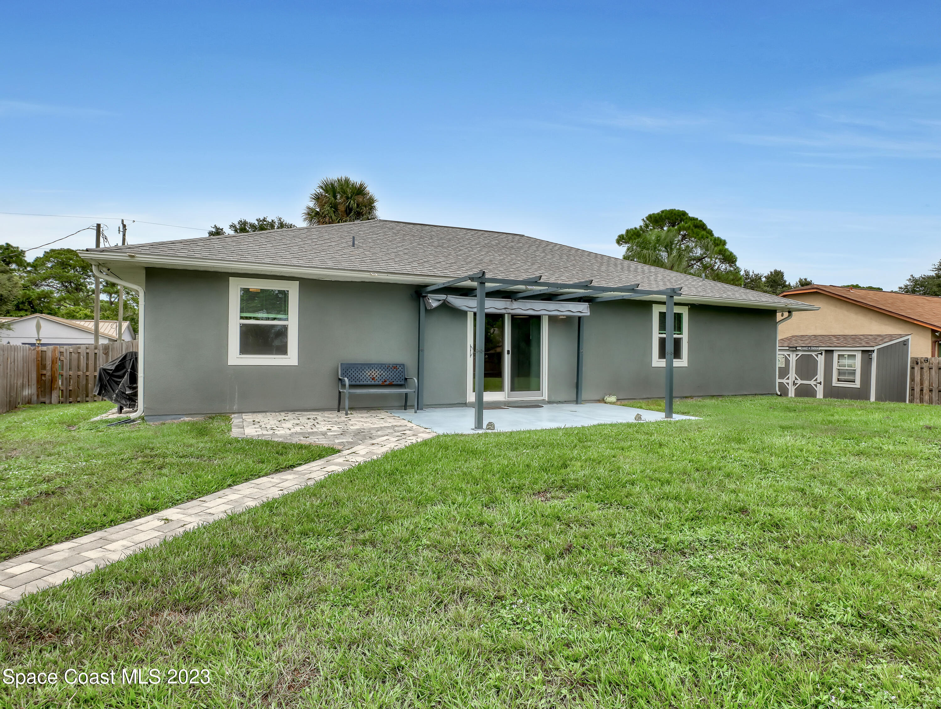 5233 Carrick Road Cocoa, FL 32927 - Photo 27 of 32 a front view of a house with a garden