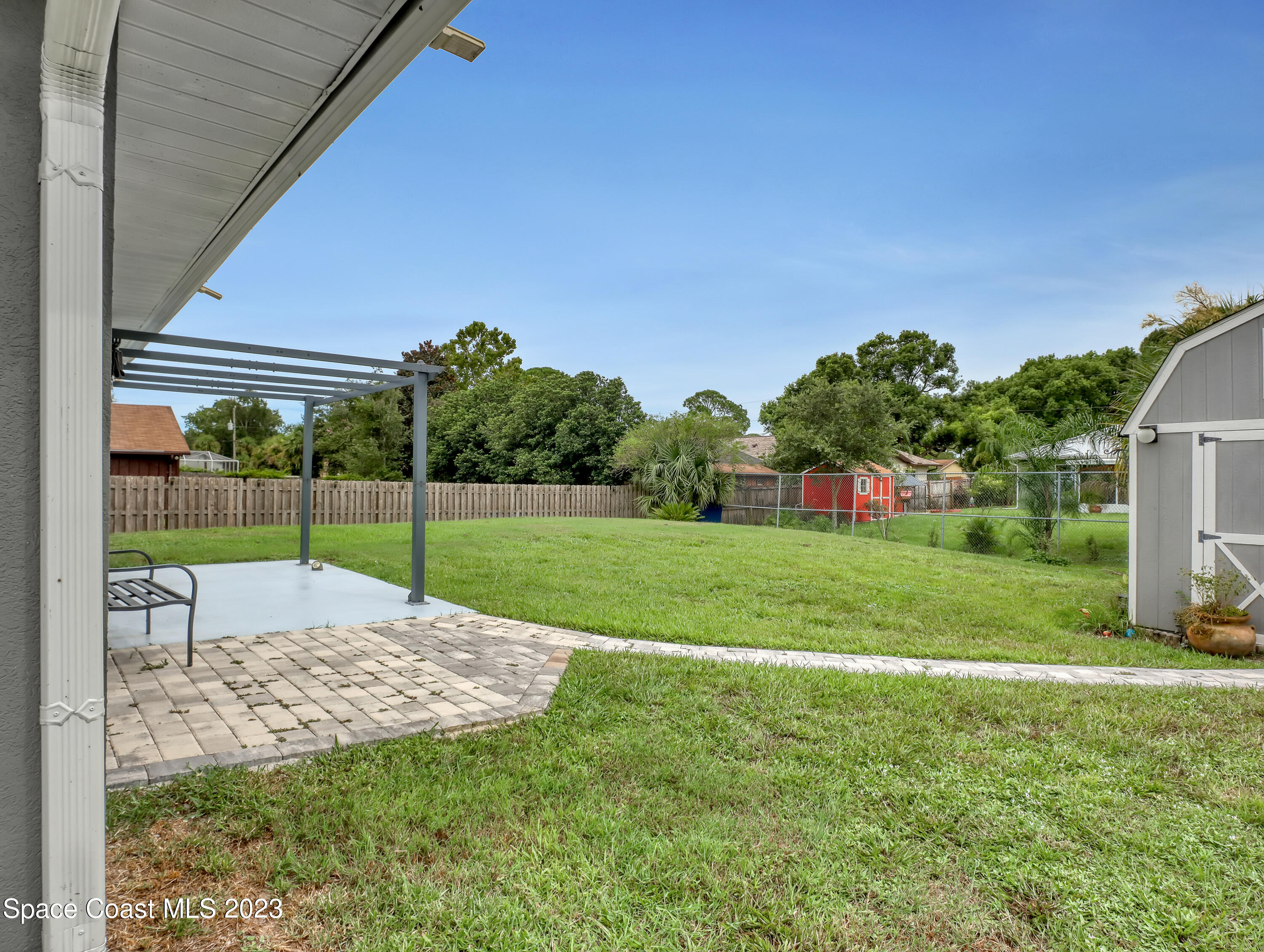 5233 Carrick Road Cocoa, FL 32927 - Photo 28 of 32 a view of a house with a backyard