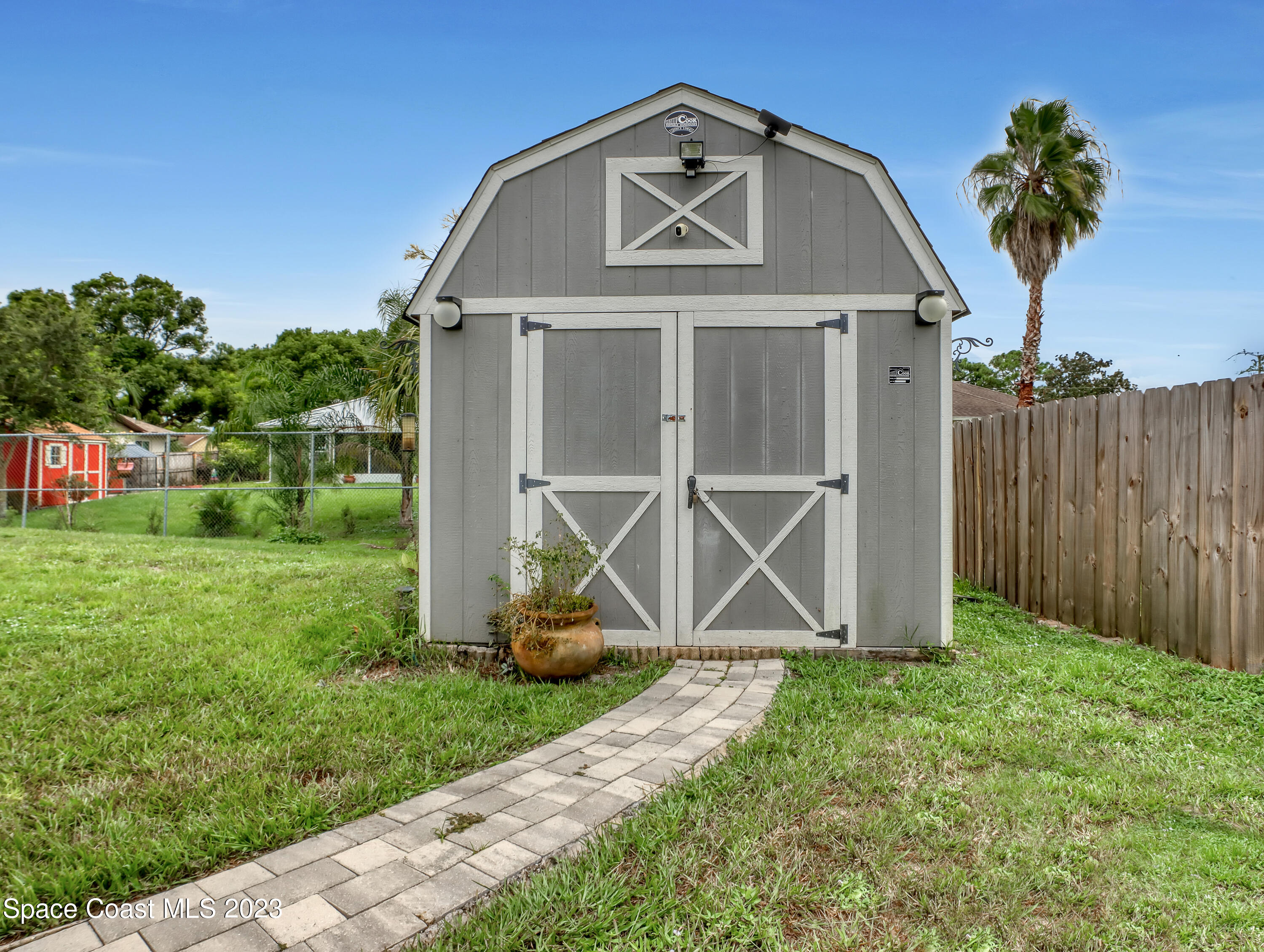 5233 Carrick Road Cocoa, FL 32927 - Photo 29 of 32 a front view of a house with garden