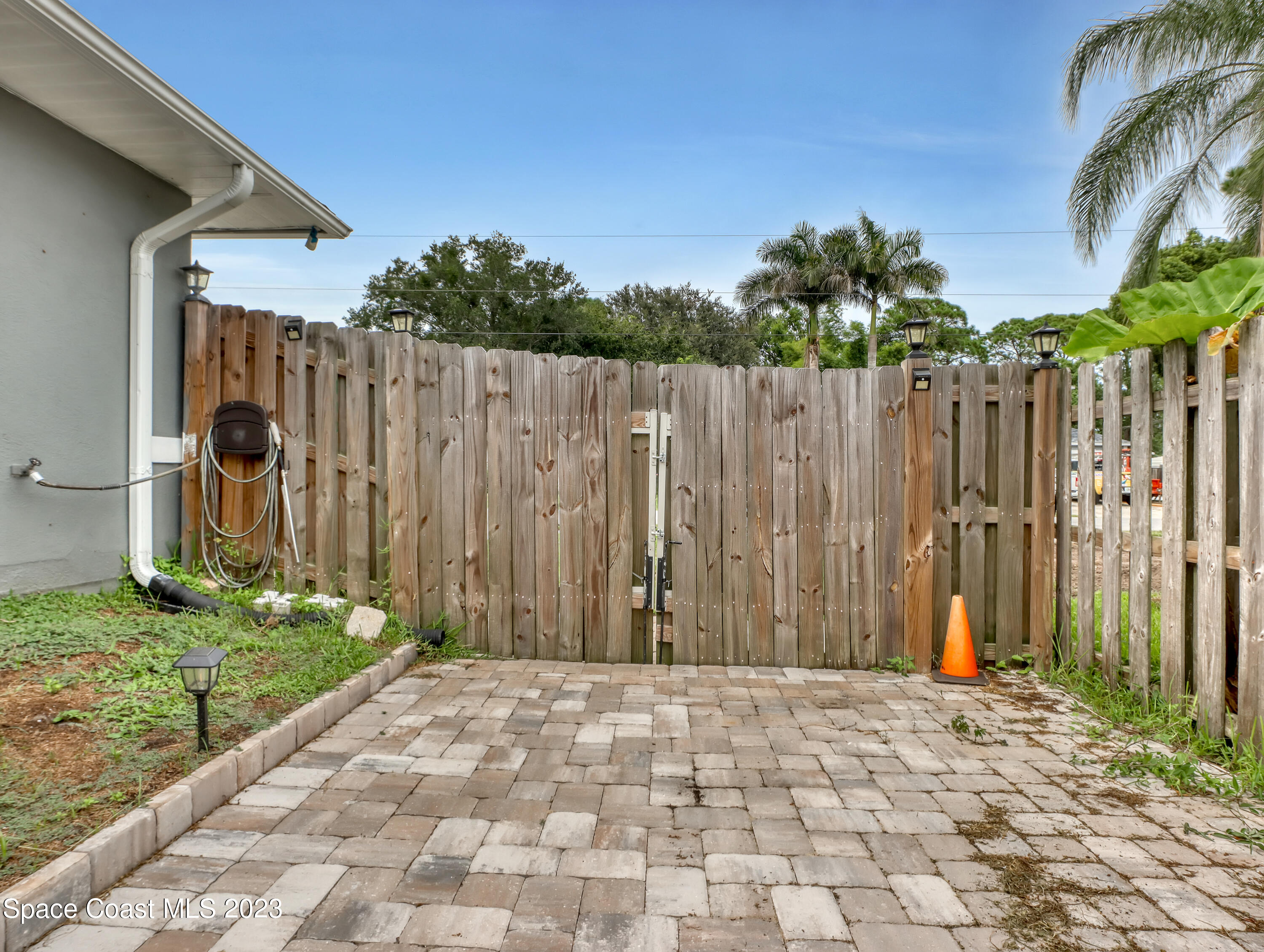 5233 Carrick Road Cocoa, FL 32927 - Photo 31 of 32 a row of white house with wooden fence