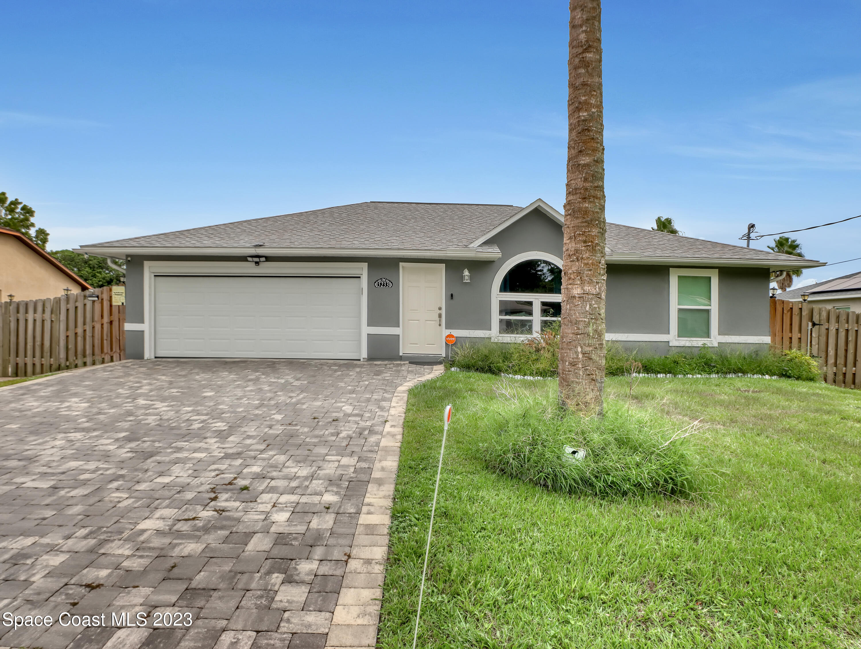 5233 Carrick Road Cocoa, FL 32927 - Photo 32 of 32 a front view of a house with a yard