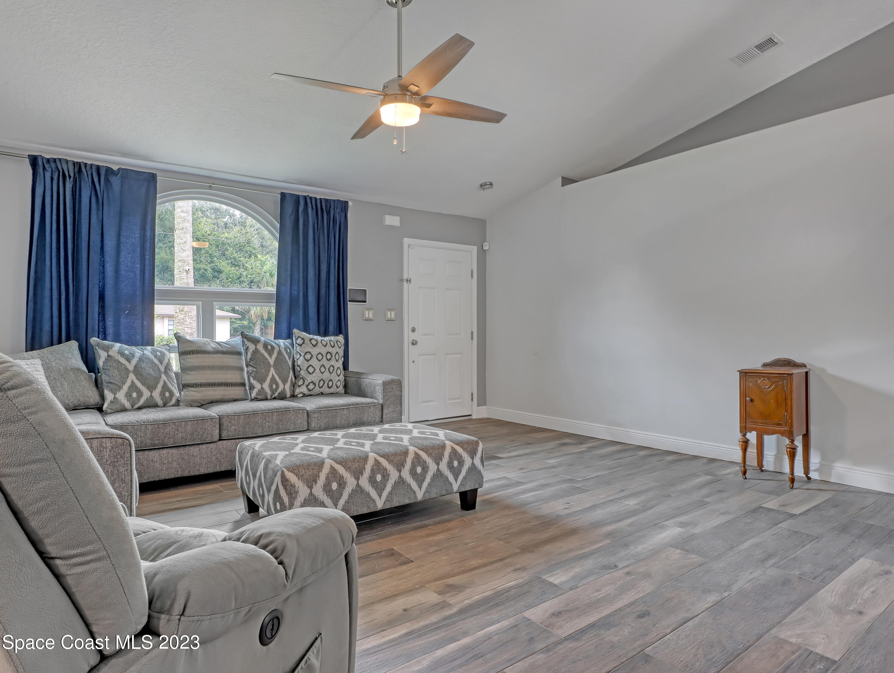 5233 Carrick Road Cocoa, FL 32927 - Photo 6 of 32 a living room with furniture and a window