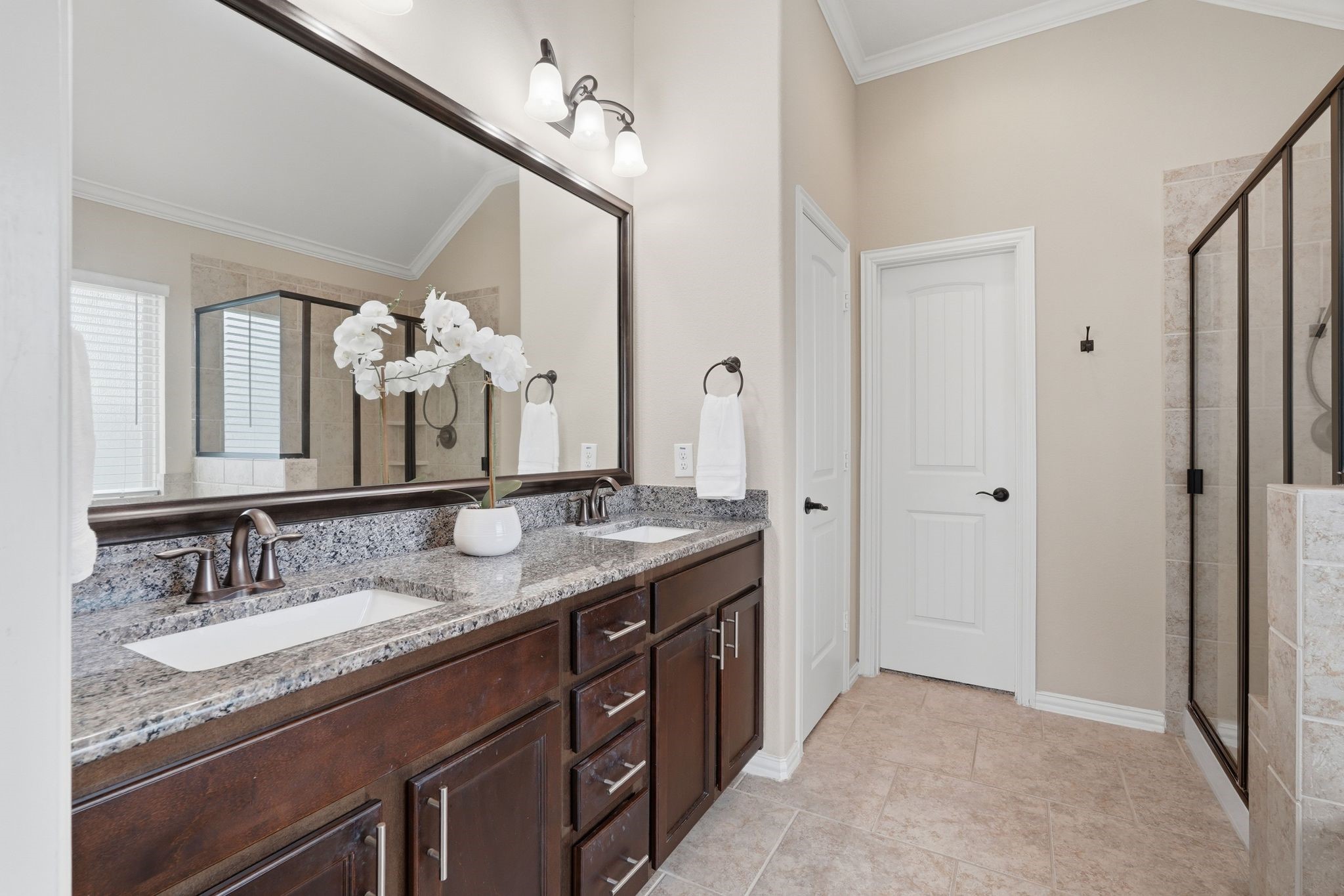 18227 Tacoma Ridge Drive Tomball, TX 77377 - Photo 24 of 45 Spa-inspired primary bath with a soaking tub, oversized shower, and natural light.