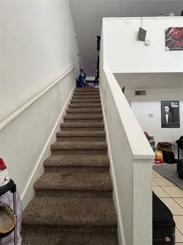 a bed room with a bed and a television