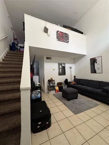 a living room with furniture and a couch
