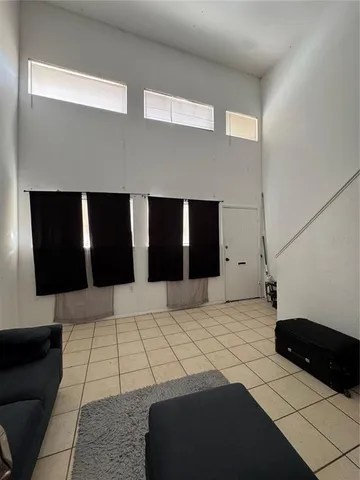 a bedroom with a large bed and a walk in closet