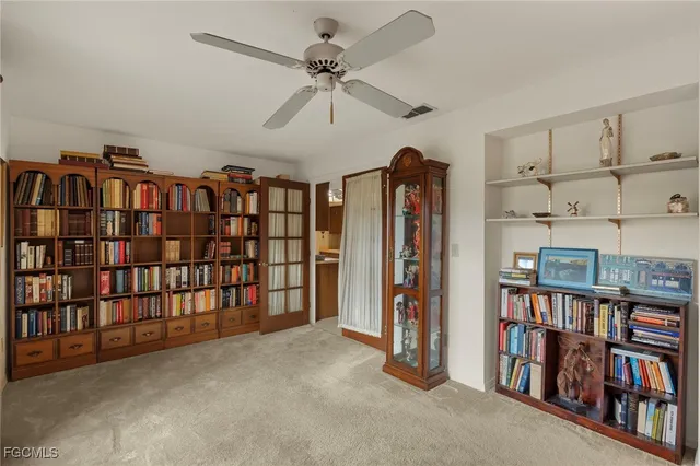 a view of a livingroom with a bookshelf