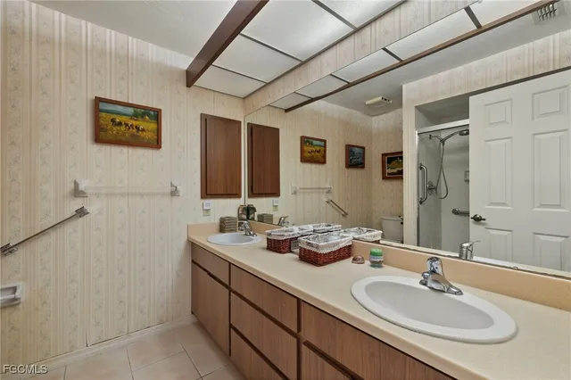 a bathroom with 2 sink and a mirror