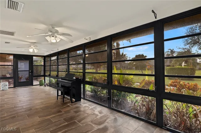 a view of a floor to ceiling window and wooden floor