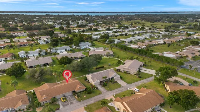an aerial view of a house with a lake view