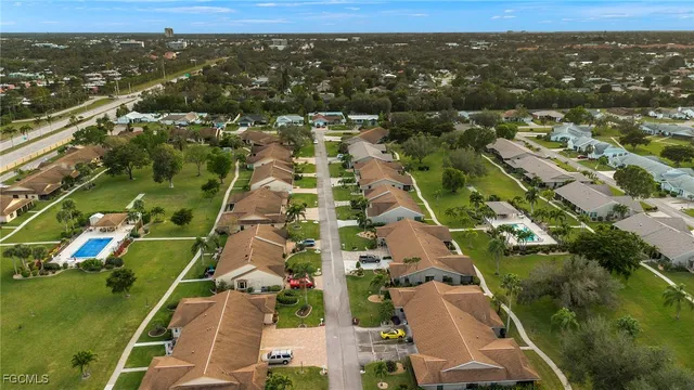 an aerial view of residential houses with outdoor space