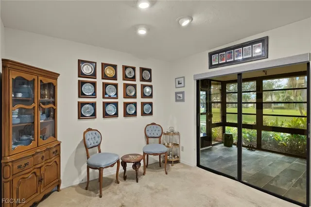 a view of a livingroom with furniture and entryway