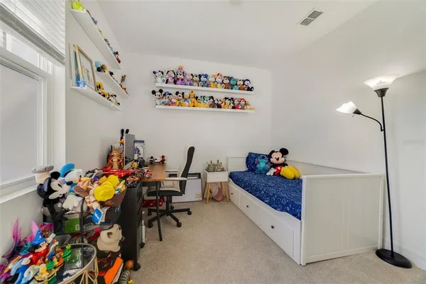 a bed room with a bed and a couch