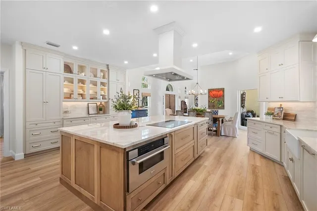 a kitchen with stainless steel appliances granite countertop a stove and a sink