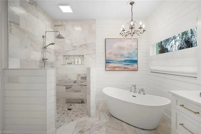a bathroom with a sink mirror and toilet