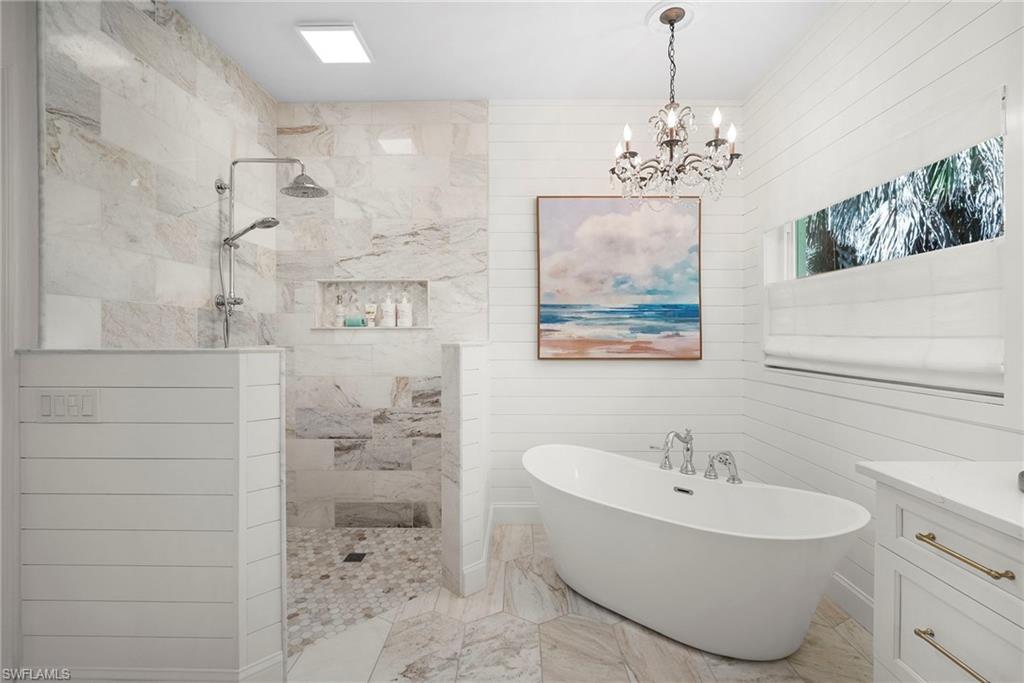 3110 70th Street Southwest Naples, FL 34105 - Photo 29 of 50 a bathroom with a sink mirror and toilet