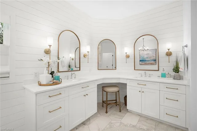 a bathroom with a double vanity sink and a mirror