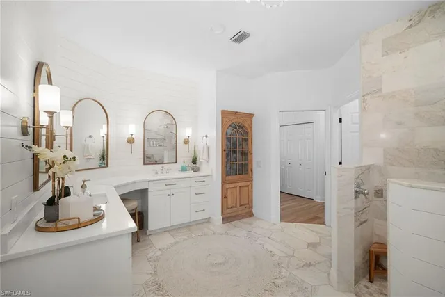 a kitchen with stainless steel appliances a sink and cabinets