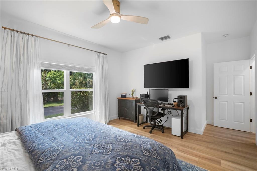 3110 70th Street Southwest Naples, FL 34105 - Photo 36 of 50 a view of a workspace with furniture and a window
