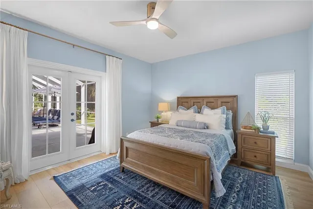 a bedroom with a bed wooden floor and a rug