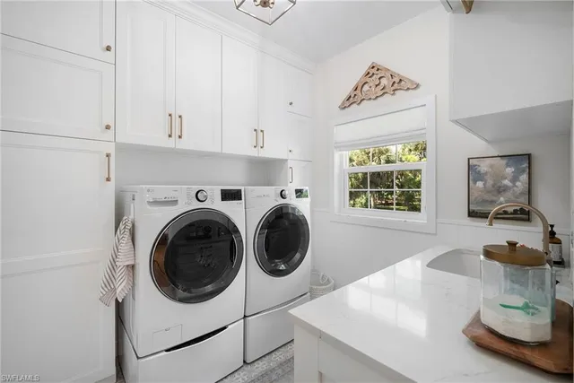 a view of a kitchen with washer and dryer