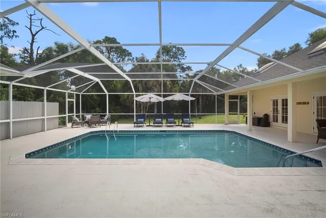 a view of a swimming pool with a patio