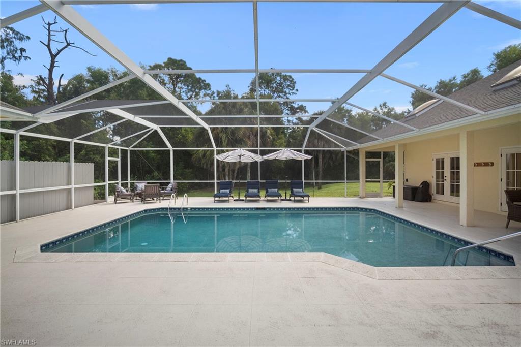 3110 70th Street Southwest Naples, FL 34105 - Photo 46 of 50 a view of a swimming pool with a patio
