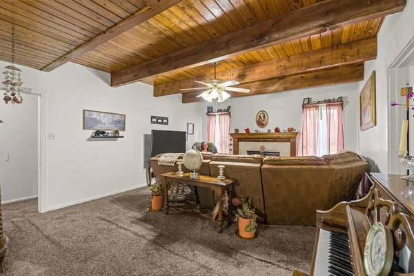 a bedroom with bed and a chandelier