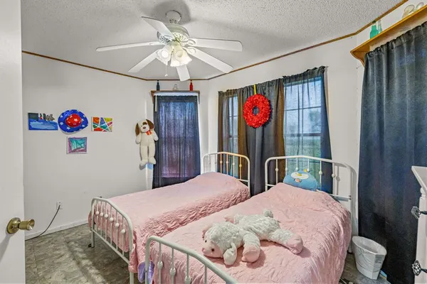 a bed room with a bed and a chandelier