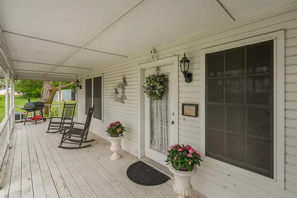 a view of entryway with wooden floor