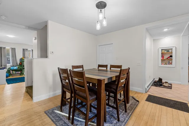 a view of washer and dryer with wooden floor