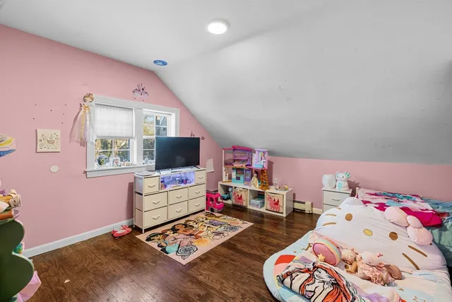 a white toilet sitting next to a shower curtain