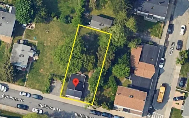 an aerial view of residential houses with outdoor space