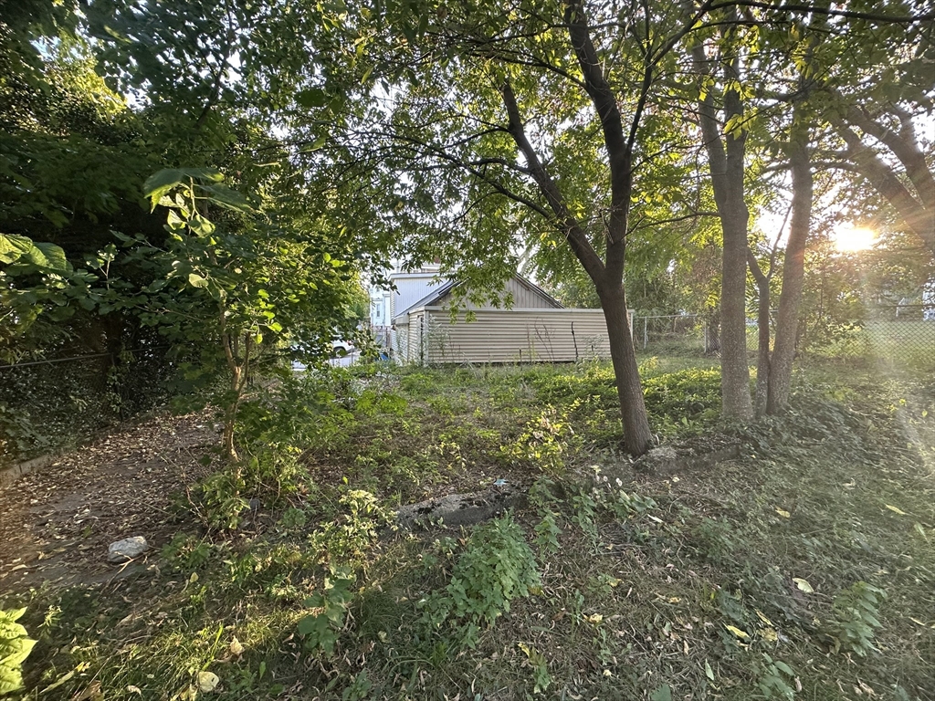 472 Buffinton Street Fall River, MA 02721 - Photo 5 of 16 a view of a house with a tree