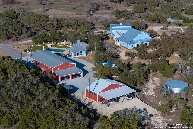 an aerial view of residential houses with outdoor space