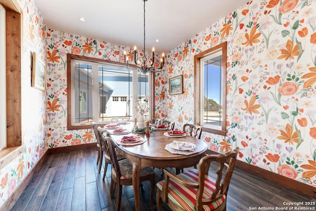 a view of a livingroom with furniture and bookshelf