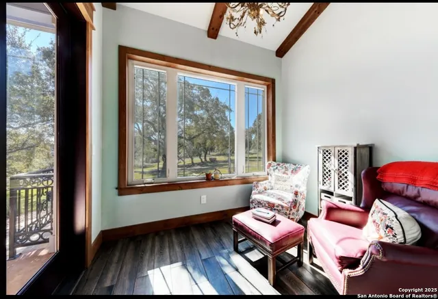 a bathroom with a sink a toilet a mirror and shower
