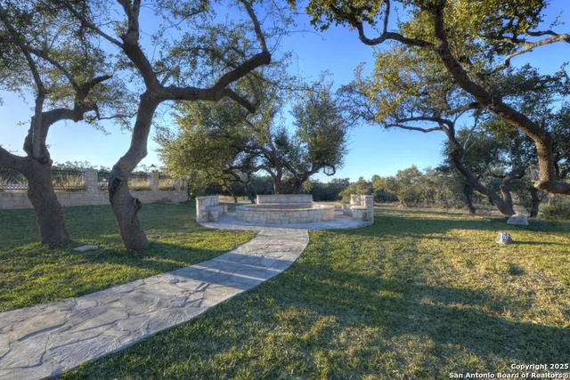 a spacious bathroom with a toilet sink and a mirror