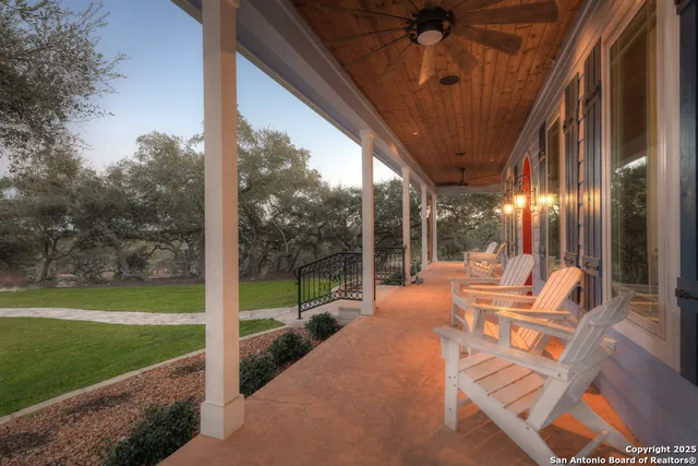 a front view of a house with a garden and porch