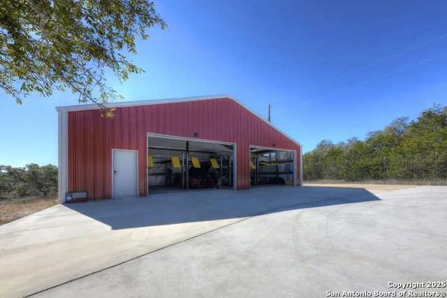 a view of a balcony with a floor to ceiling window and wooden fence