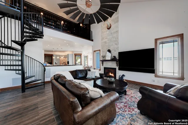 a large kitchen with stainless steel appliances kitchen island granite countertop a large island in the center