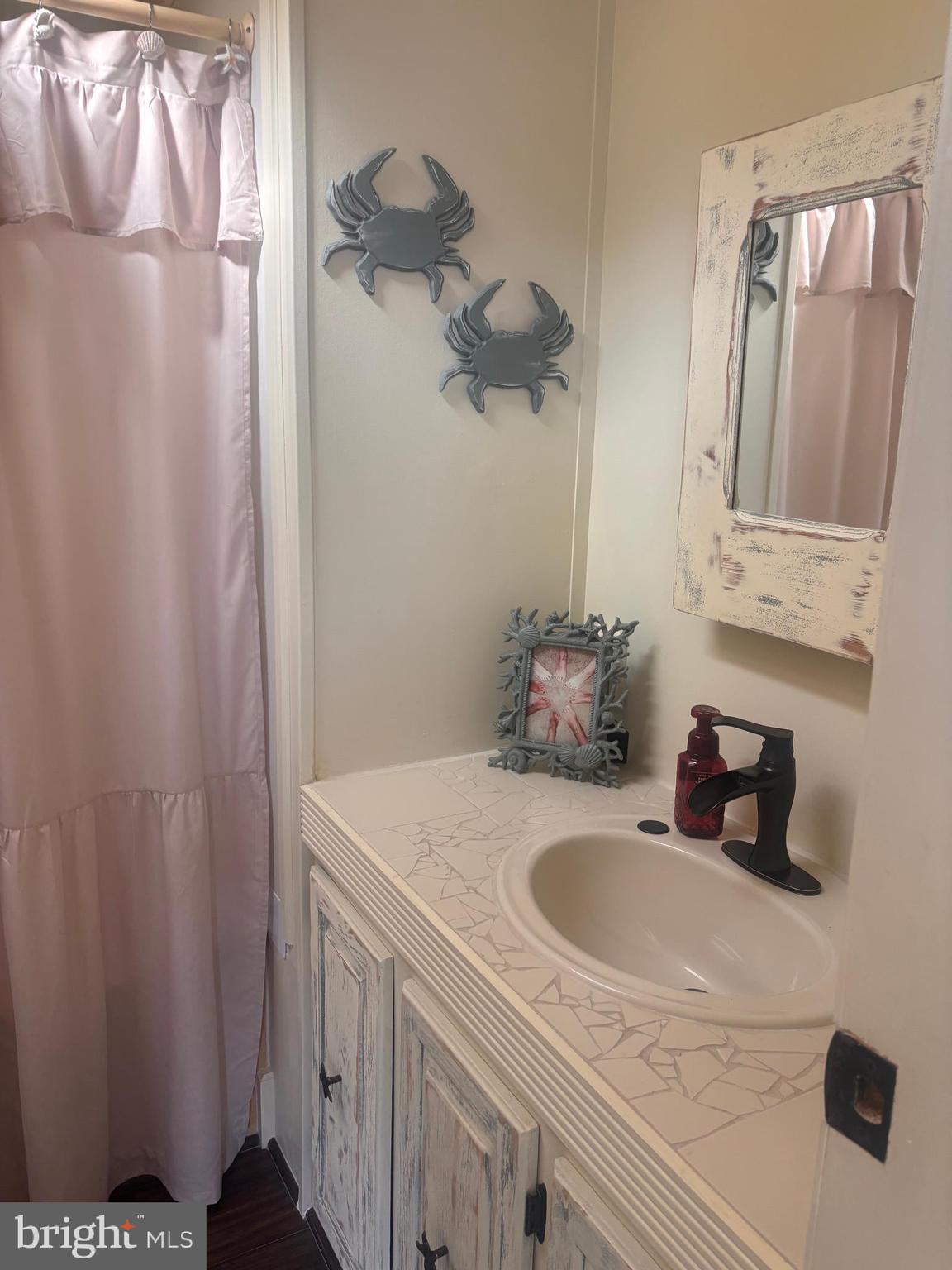 7 Shell Lane Egg Harbor Township, NJ 08234 - Photo 16 of 22 a bathroom with a sink and vanity