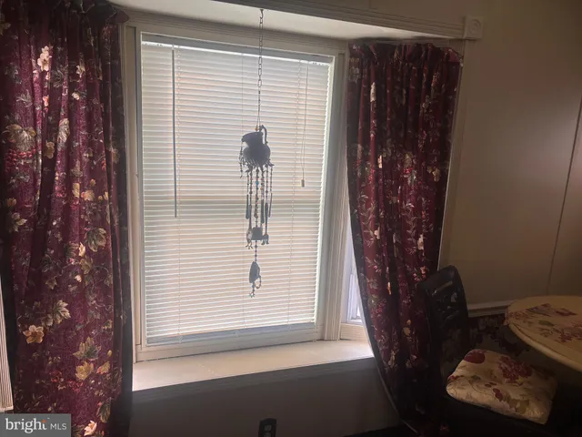 a kitchen with a stove and white cabinets