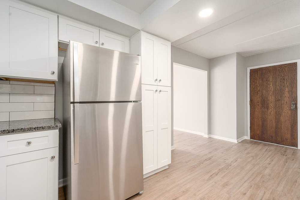 21 South Waiola Avenue, Unit 8 La Grange, IL 60525 - Photo 13 of 18 a view of a refrigerator in kitchen and empty room